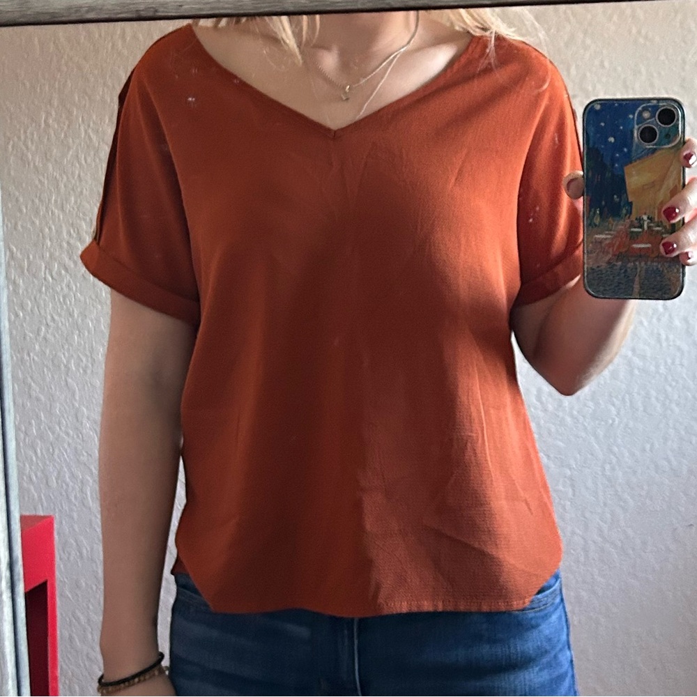 Orange top with buttons